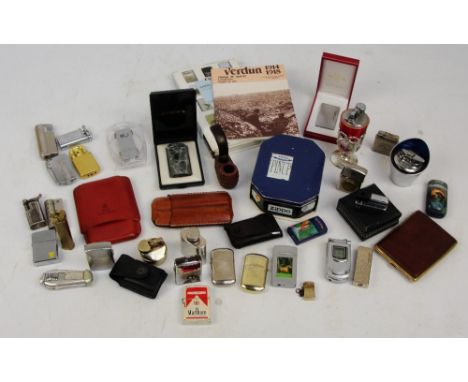 A collection of lighters including examples by Corona, Colton, etc, also a pipe, cigar cases, and a reference work on Zippo l