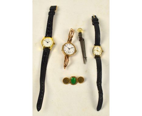 A ladies vintage 9ct gold cased wristwatch with circular white enamel dial set with Arabic numerals, two further wristwatches