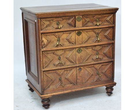 A late 17th century oak geometrically moulded chest of two short and three long drawers raised on later turned feet, width 93
