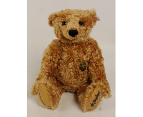 A boxed Steiff 1997 Winston teddy bear, no. 652837, retailed by Hamleys, with numbered white and red tag to ear, with pale br