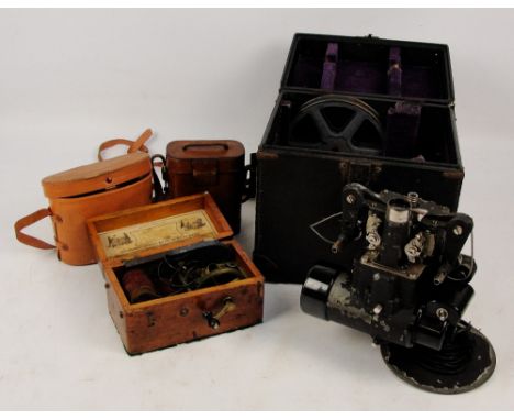 A Bell and Howell automatic cine projector in a lined case, an improved Magneto electric machine for nervous diseases, in woo