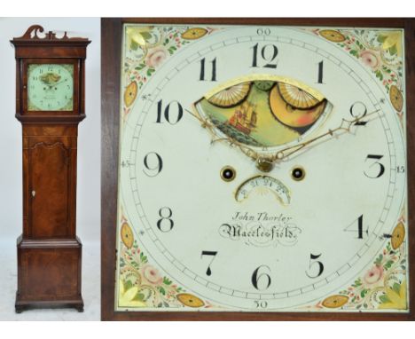 A George III mahogany and inlaid eight day longcase clock, the broken swan neck pediment above square painted dial set with r