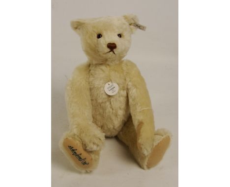 A boxed Steiff 1996 replica 1921 teddy bear, no. 407123, with numbered white and black tag to ear, with clipped off white moh