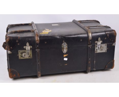 An early 20th century leather trimmed and wooden bound travelling trunk, length 79cm.