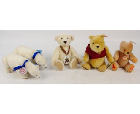 A boxed Steiff Winnie the Pooh, no. 651489, with numbered button in ear, 5611 of limited edition of 10,000, seated height 27c