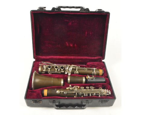 A cased "Blessing" bakelite clarinet. CONDITION REPORT: Postage cost within UK would be at most £21.60, but please confirm af