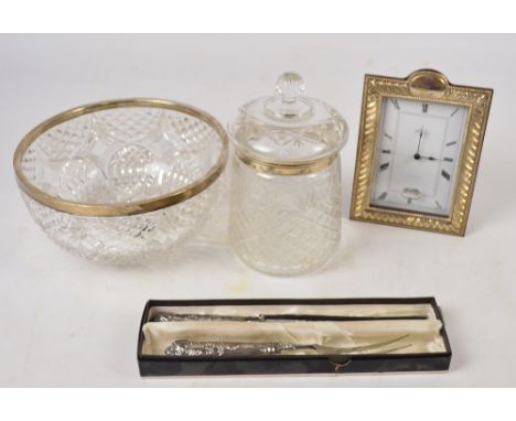 A modern boxed R. Carr standing timepiece with sterling silver frame, height 20cm, a cut glass bowl with silver rim, a cut gl