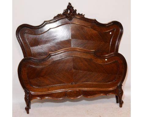 A pair of reproduction Louis XV style bed ends with carved central scroll motif, and lobed sides, width 162cm.
