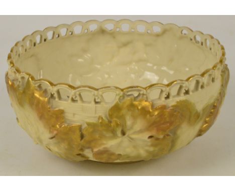 A Royal Worcester blush ivory gilt heightened basket weave effect bowl with pierced rim and raised leaf decoration, puce mark