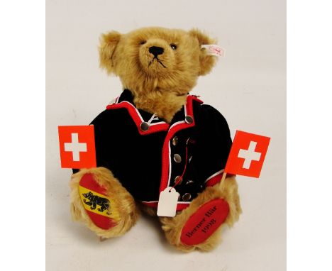 A boxed Steiff 1998 Berner bear, no. 659928, with numbered white and red tag to ear, with blonde fur and Swiss alpine herdsma