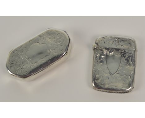 A Victorian hallmarked silver vesta case overall engraved with foliate scrolls centred with a shield shaped vacant cartouche,