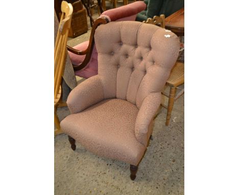 A Victorian style button back armchair