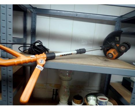 Electric extendable work grass strimmer. All electrical items in this lot have been PAT tested for safety and have passed. Th