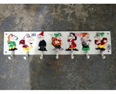 Cast iron seven dwarves cup rack, L: 60 cm. UK P&amp;P Group 3 (£30+VAT for the first lot and £8+VAT for subsequent lots) 