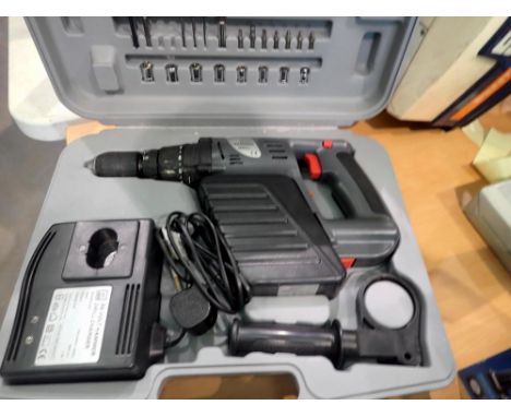 Cased hammer drill with charger and drill bit accessories. All electrical items in this lot have been PAT tested for safety a