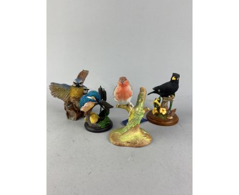 LOT OF SEVEN BIRD FIGURES, including ceramic and resin examples, along with other figures, including one of a girl with geese