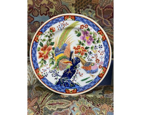 EARLY 20TH CENTURY ROYAL WORCESTER HAND PAINTED CIRCULAR PLATE, painted with birds in flight, 14cm diameter, along with a Bel