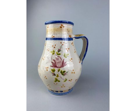 FLORAL HANDPAINTED CERAMIC EWER, 26cm high, along with two decorative tea pots and a handpainted candlestick (4)