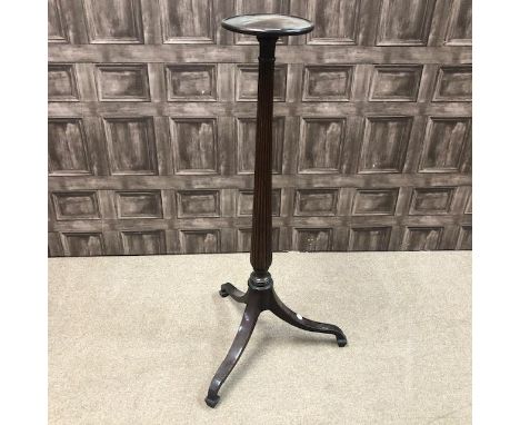 MAHOGANY TORCHERE, with fluted column and tripod supports, 112cm high