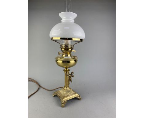 VICTORIAN BRASS OIL LAMP, with funnel and shade and with cherub in relief