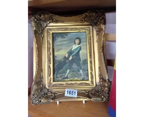 An Ormalu gilt framed enhanced print of a boy with dog