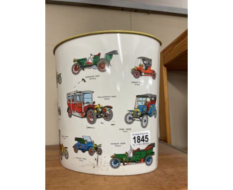 A vintage Worcester ware tin waste paper bin decorated with vintage cars