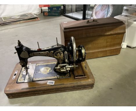 A vintage cased Frister and Rossman sewing machine, COLLECT ONLY.