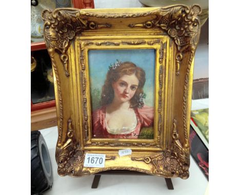An Ormalu gilt framed enhanced print of a portrait