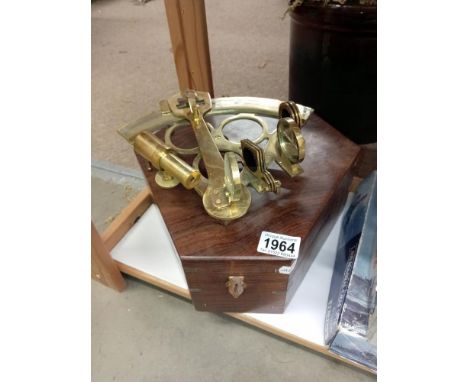 A brass sextant in hard wood box (missing 1 mirror)