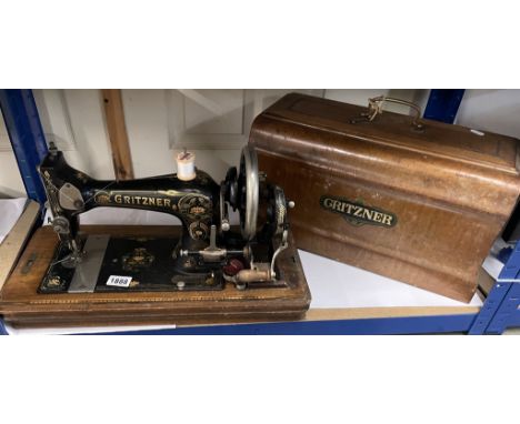 A vintage cased Gritzner hand operated sewing machine. COLLECT ONLY.