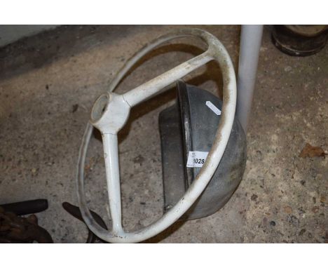 Vintage steering wheel together with one other item