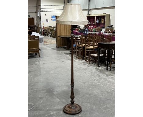 A walnut lamp standard