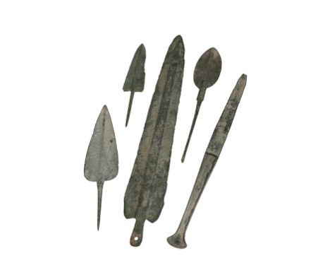A LURISTAN BRONZE ARROW HEAD circa 1500-800 BC, two others, a small Luristan bronze knife and a bronze spear head with flatte