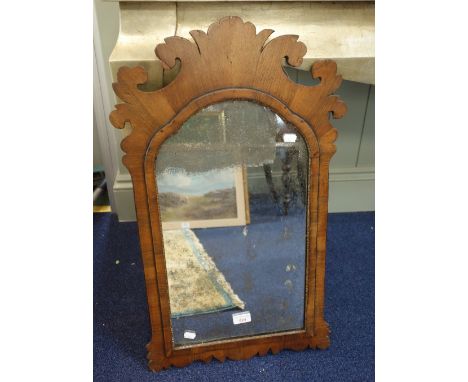 A GEORGE III MAHOGANY FRAMED WALL MIRROR with fretwork crest and original plate, 43cm wide 