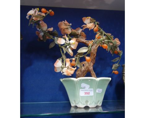 AN ORIENTAL "JADE" TREE in a glazed celadon style pot