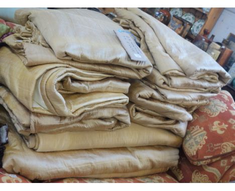A SUITE OF LINED GOLD SILK CURTAINS, seven 244cm drop x 122cm wide and two smaller (9)