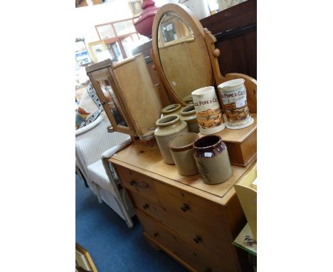 AN EDWARDIAN STRIPPED PINE DRESSING CHEST with oval mirror and a small stripped pine hanging corner cabinet with mirror door