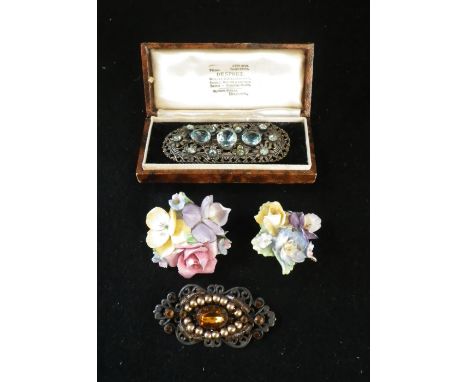 TWO METAL BROOCHES and two ceramic brooches (4)