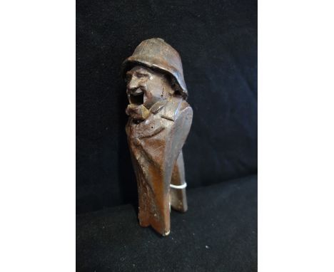 A 19TH CENTURY FOLK ART CARVED WOODEN NOVELTY NUTCRACKER in the form of a jolly farmer