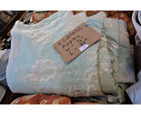 A SUITE OF SIX LINED GREEN CURTAINS with cream floral decoration, each 220cm drop x 193cm wide