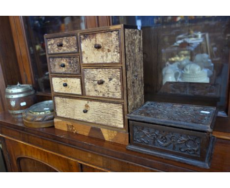 AN OAK CASED MARINE ANEROID BAROMETER by John Barker &amp; Co Ltd, Kensington, London, an Arts and Crafts oak jewellery box, 