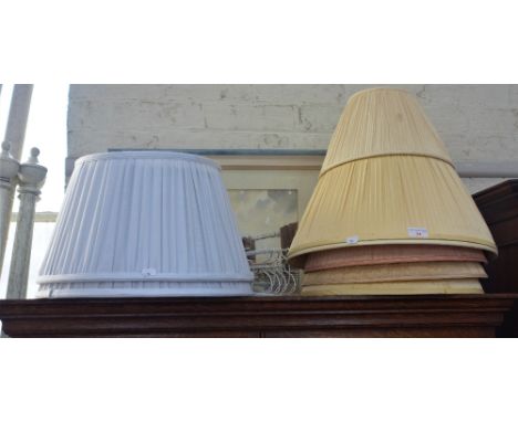 A COLLECTION OF LAMP SHADES in various colours