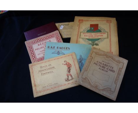 A COLLECTION OF CIGARETTE CARDS in albums and a leaflet bearing Hugh Gaitskell's signature 