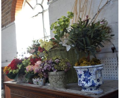 A LARGE COLLECTION OF ARTIFICIAL FLOWERS in ceramic and other jardinieres 