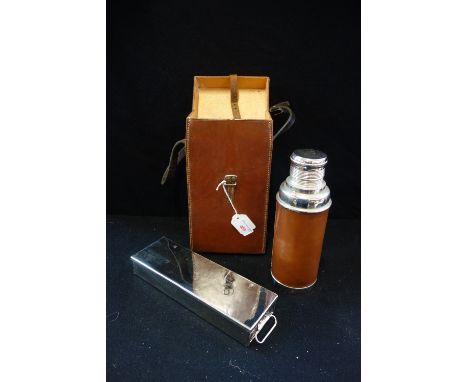 A CHROME PLATED SANDWICH BOX and chrome and leather covered flask in a leather carrying case 