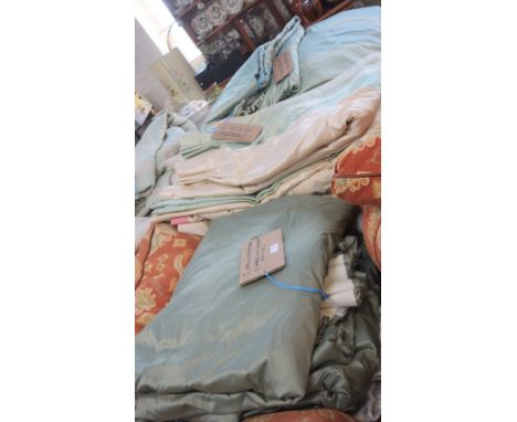 A SUITE OF PALE GREEN AND CREAM IVORY LINED SILK CURTAINS, four 183cm x 183cm and similar sizes (14 curtains some smaller)