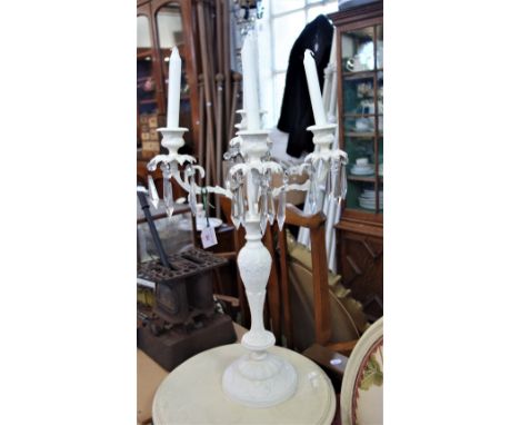A WHITE METAL PAINTED FIVE SECTION CANDELABRA with glass lustre drops 