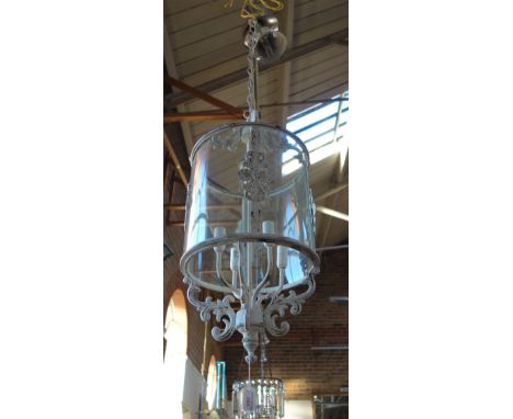 A HALL LANTERN of cylinder form, with glass shade and a mottled painted finish, 70cm high (approx)