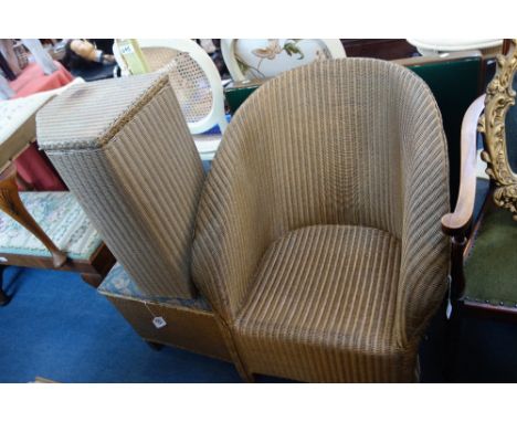 A LLOYD LOOM LAUNDRY BASKET, a similar stool, an armchair, a card table and an onyx standard lamp 