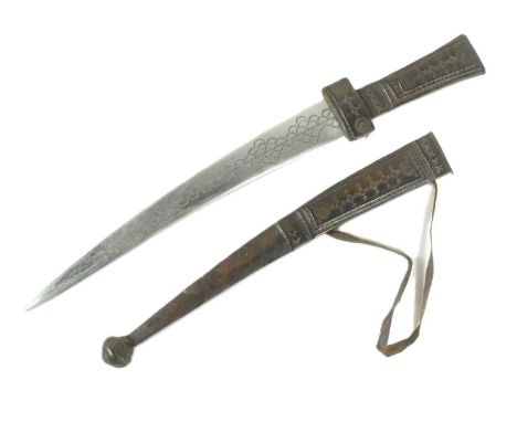 A mid-20th Century Nigerian West African Hausa people tribal dagger knife I Tuareg. Tooled leather handle and guard with tape